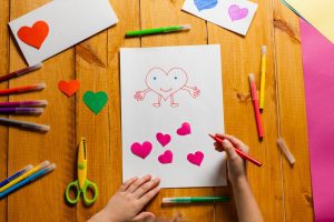 Kid Drawing a Card