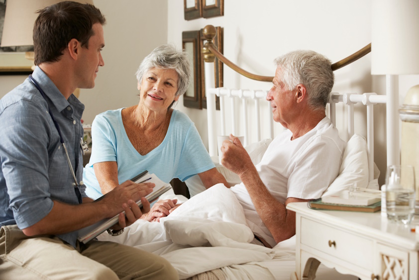 couple meeting with palliative care nurse