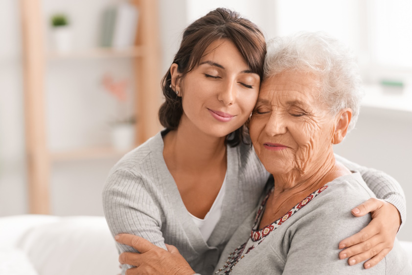 woman comforting senior mother