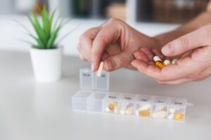 pills being sorted in pill box