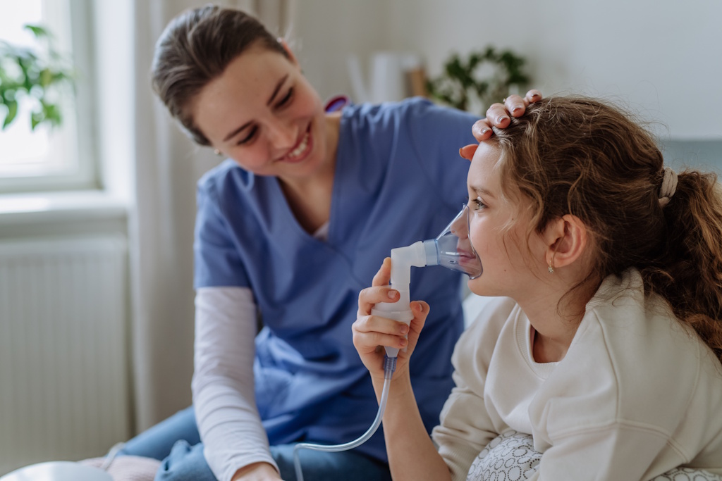 pediatric home health nurse with girl