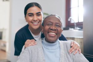 home caregiver smiling with senior woman