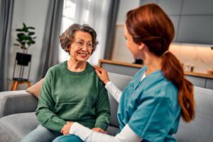 home nurse checking on senior woman