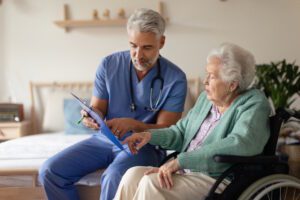 male home nurse with senior woman
