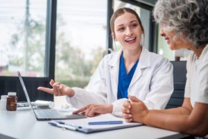 RN case manager meeting with senior woman
