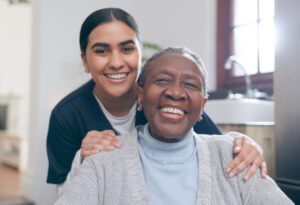 senior woman smiling with caregiver