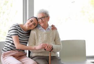 woman hugging elderly grandmother