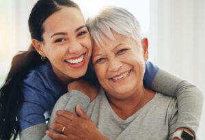 caregiver smiling with a patient