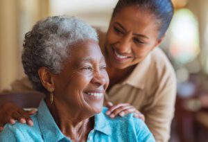older woman smiling with caregiver