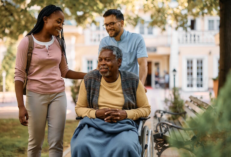 woman with senior father in wheelchair